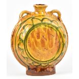CLIVE BOWEN (born 1943); a slipware pilgrim bottle, green decoration on honey ground, height 28.5cm.
