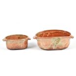 ALEX SHIMWELL (born 1980); two lugged stoneware dishes covered in shino and ash glaze, impressed S