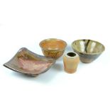 A group of stoneware studio ceramics including two bowls, and slab dish and vase, various marks,