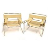 Two Wassily chairs, in the style of Marcel Breuer, with tubular chrome supports.