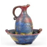 MICHAEL KENNEDY; a matching stoneware jug and bowl covered in polychrome decoration, incised marks