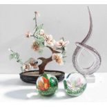 An Italian-style studio glass sculpture on square clear glass socle base, two floral paperweights,