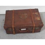 A vintage brown leather steamer case,