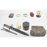 A mixed lot including a bayonet, a carved coquilla nut, a faux tortoiseshell purse,