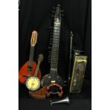 A group of stringed instruments including a sitar for restoration, banjolele etc, and a large