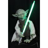 STAR WARS; a Yoda figure with lightsaber adapted from a green fluorescent tube, height approx 80cm.