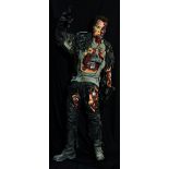 THE TERMINATOR; a large T-1000 figure with exposed robotic parts holding guns in both hands modelled