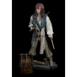 OXMOX & THE PIRATES OF THE CARIBBEAN; a large Captain Jack Sparrow figure with cutlass, height
