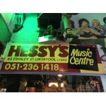 THE BEATLES; an original ‘Hessy’s Music Centre’ sign, approx 183 x 61cm. Additional