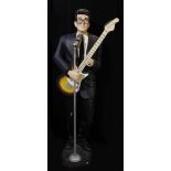 A large Buddy Holly figure with guitar, height approx 185cm.