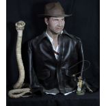 INDIANA JONES; a bust in iconic outfit, height approx 82cm, a model cobra and a smaller figure