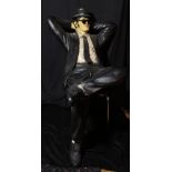 THE BLUES BROTHERS; two large figures modelled after John Belushi and Dan Ackroyd in seated poses,