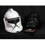 STAR WARS; a plastic Darth Vader helmet and further Imperial Forces helmet, both with voice