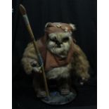 STAR WARS; an Ewok figure, height including circular stand (excluding staff) approx 80cm.