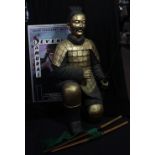 THE SEVEN SAMURAI; a framed reproduction poster, approx 90 x 61cm, and a large kneeling figure of