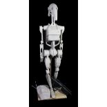 STAR WARS; a large paper model droid with gun and accessory/backpack, height including wooden base