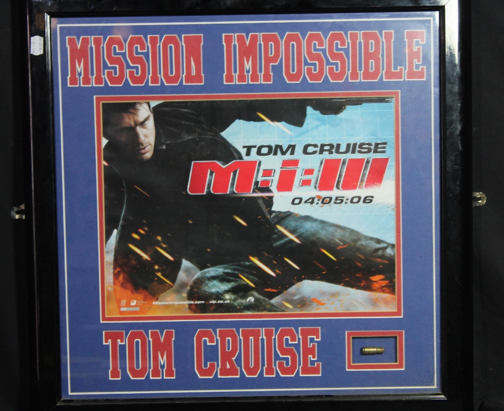 MISSION IMPOSSIBLE; a screen used bullet shell fired on set by Tom Cruise, presented in glazed