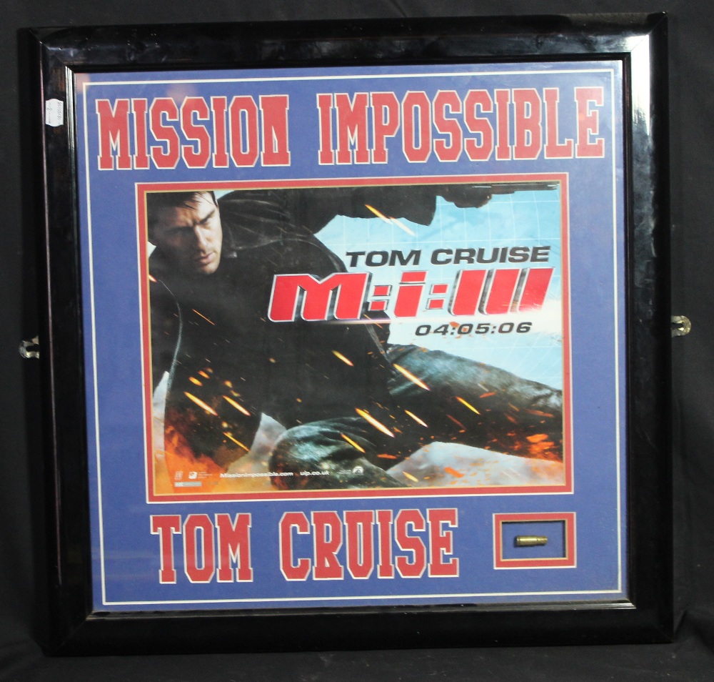 MISSION IMPOSSIBLE; a screen used bullet shell fired on set by Tom Cruise, presented in glazed - Image 2 of 3