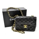 CHANEL; a black soft leather Timeless/Classique quilted leather handbag, with front flap and gold '