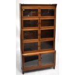 MINTY; an oak five tier stacking bookcase with glazed doors, 175 x 89cm.