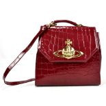 VIVIENNE WESTWOOD; a 'Bowler in Chancery' burgundy faux crocodile skin bag, 35 x 33cm.