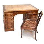 An oak twin pedestal desk with gilt tooled cream leather writing surface, 77 x 124cm and leather