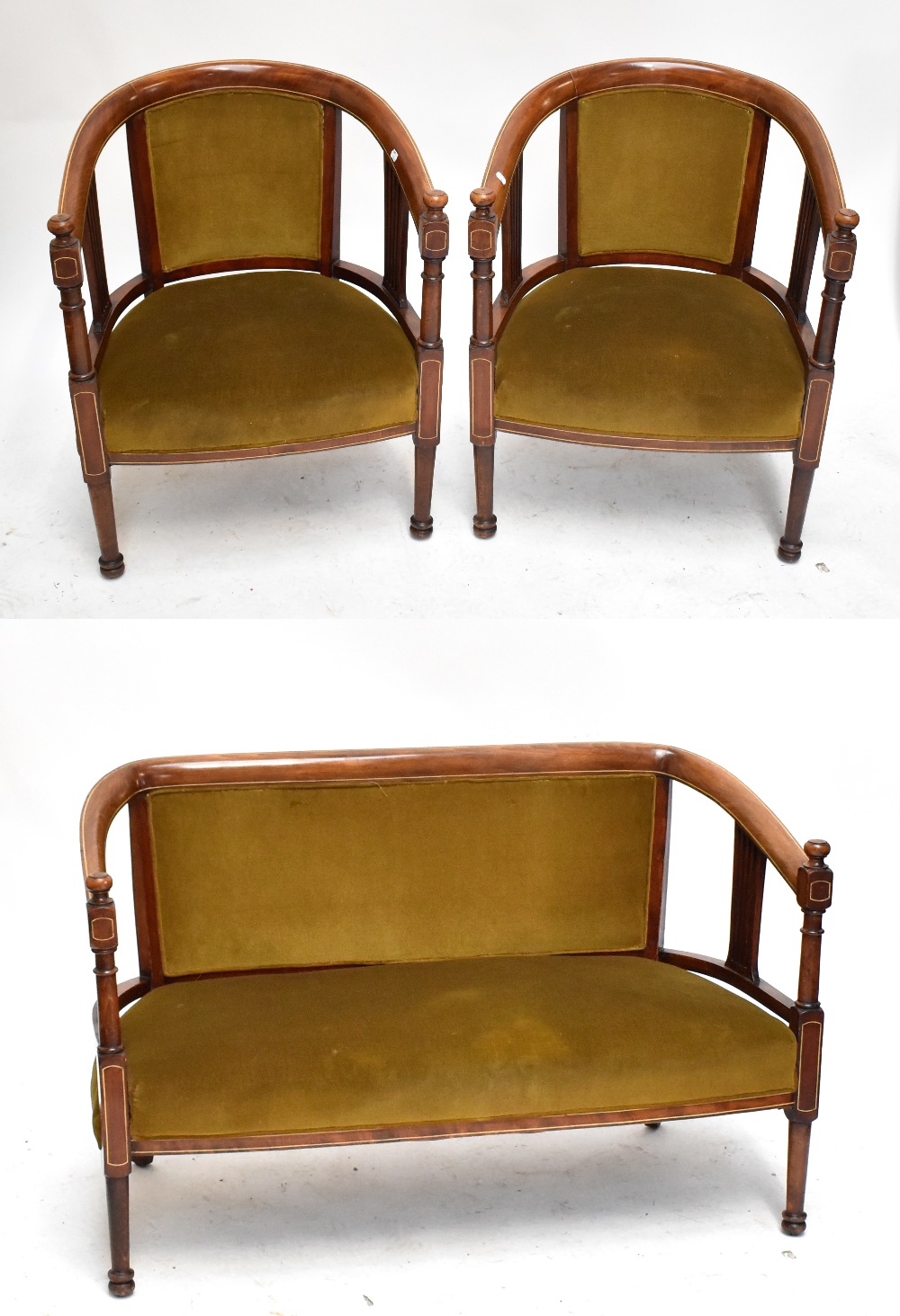 An Edwardian inlaid mahogany salon suite comprising two seater sofa and pair of armchairs