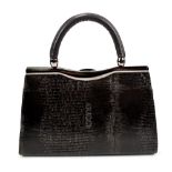 GUCCI; a dark brown faux snakeskin evening bag, with pressed Gucci logo, 25 x 16 x 7cm.