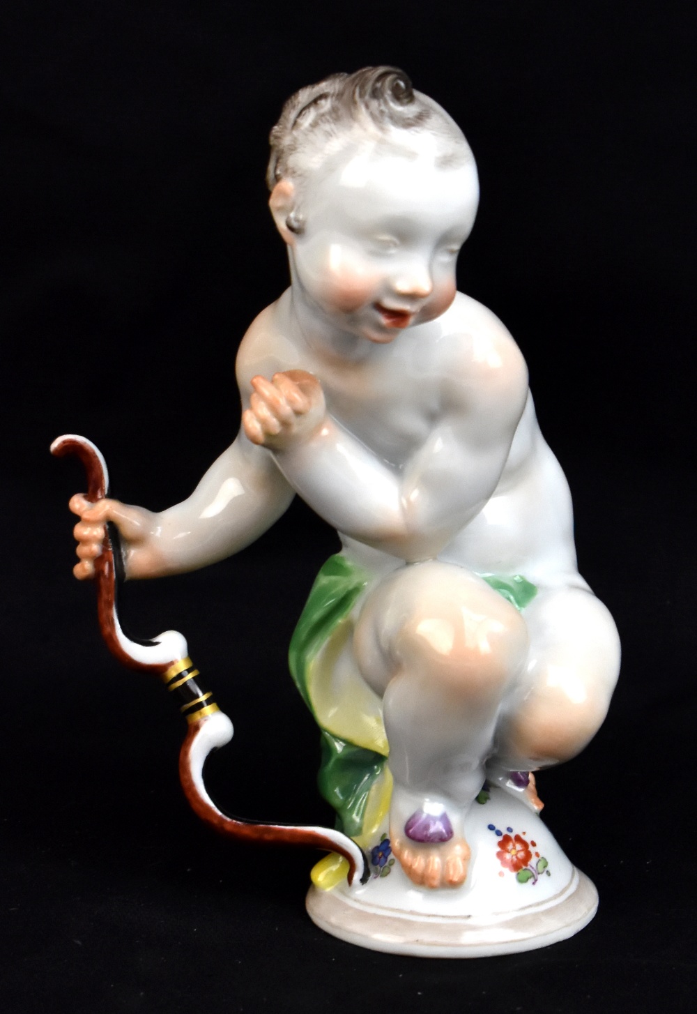 MEISSEN; an early 20th century figure of Cupid by Paul Scheurich, model no.F.275, circa 1920, blue