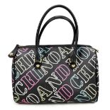 MOSCHINO; a black handbag with Moschino logo emblazoned in white, blue, green and red with black