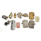 A collection of vesta cases with novelty examples including mouse, rooster head and snail shell, all