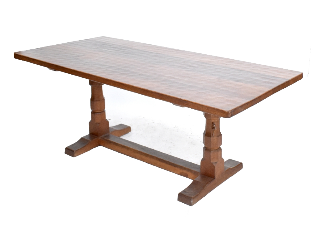 ROBERT  'MOUSEMAN' THOMPSON; an oak refectory dining table with adzed decoration to the top and