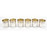 JOSEPH CROSSARD OF PARIS; a set of six early 20th century French 950 silver tot cups with bands of