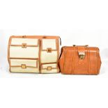 SALVATORE FERRAGAMO; a large cream canvas holdall bag, and a tan leather Gladstone style handbag (