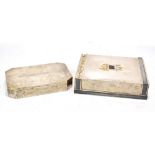 Two Indian white metal cigarette boxes of rectangular form, the first with applied decoration,