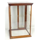 A table top mahogany glazed shop display case, the front three panes inscribed 'Cadbury's Chocolate'