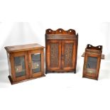 Three early 20th century smokers' cabinets including oak example with two carved and panelled