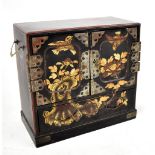 An early 20th century Japanese lacquered cabinet, having twin panelled doors above single base