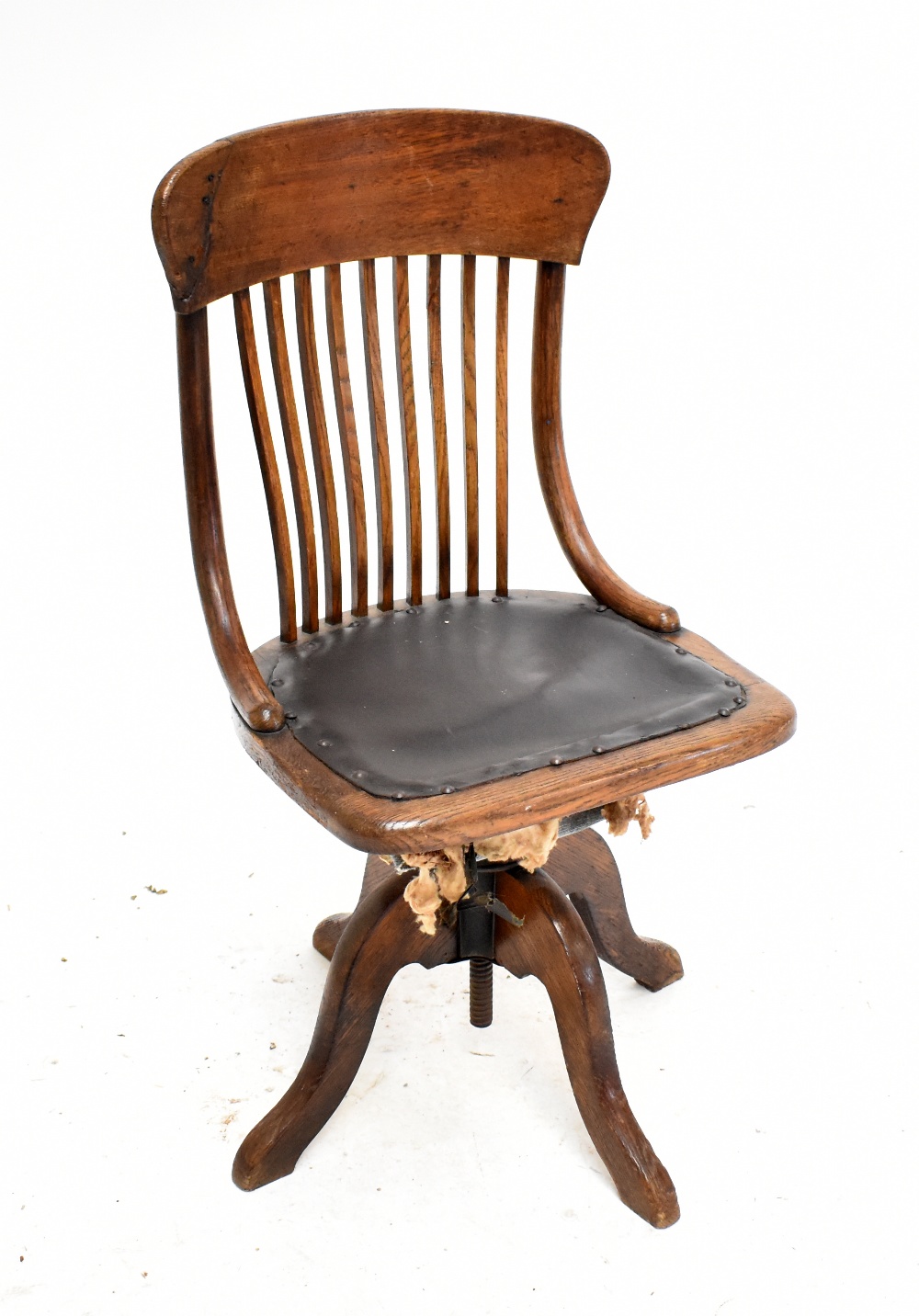 An early 20th century oak swivel desk chair.