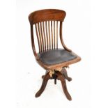 An early 20th century oak swivel desk chair.