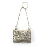 HENRY MATTHEWS; a hallmarked silver purse, repoussé decorated with a figure playing a lyre with