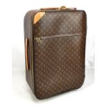 LOUIS VUITTON; a Monogram wheel rolling luggage suitcase with leather trim, 46 x 65 x 24cm.