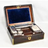 A Victorian brass bound rosewood gentleman's vanity box, the hinged cover lifts to enclose drop down