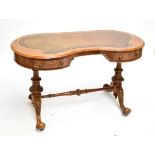 A 19th century walnut, burr walnut and inlaid kidney shaped writing table with gilt tooled green
