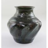 Christopher Dresser for Linthorpe; an ovoid vase with curved faceted sides,