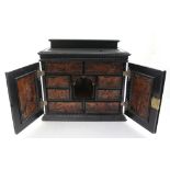 A 17th century Neapolitan or North European ebonised and marquetry table cabinet,