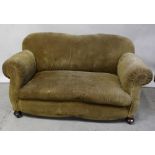 A pair of Edwardian drop-end two-seat sofas,