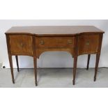 An Edwardian mahogany inlaid serpentine-front sideboard,