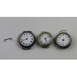 Two hallmarked silver trench watches and a silver plated trench watch (3).