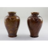 Royal Doulton; a pair of amber ground drip glaze baluster vases,